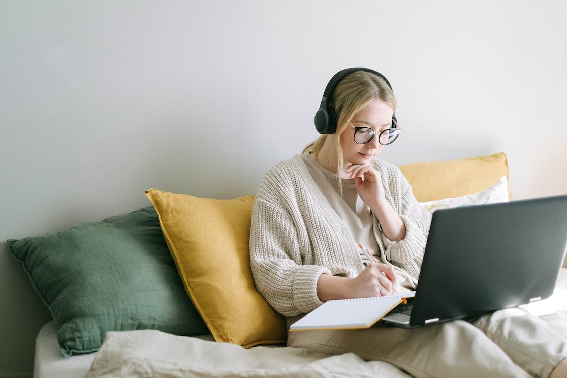 eCommerce store owner researching distributed order management on her laptop. 