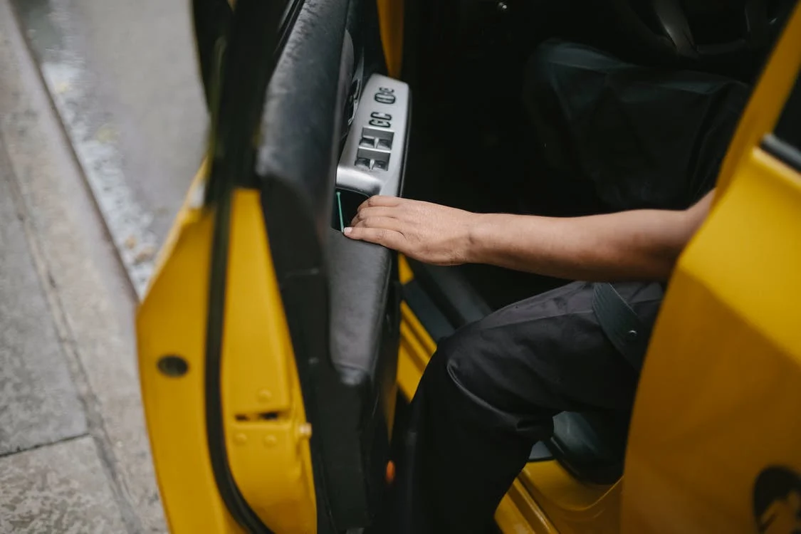 Person opening a car door from inside