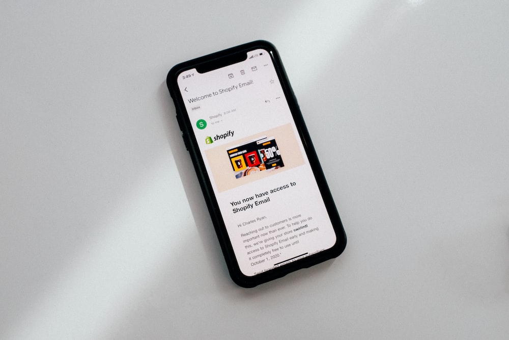 A phone showing Shopify, a good channel to sell consumer electronics on.