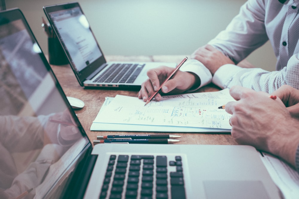 A person creating a business plan on a laptop