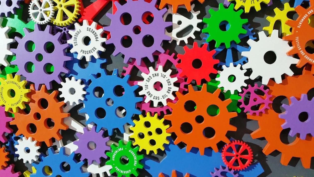 Lots of colorful gears grouped together 