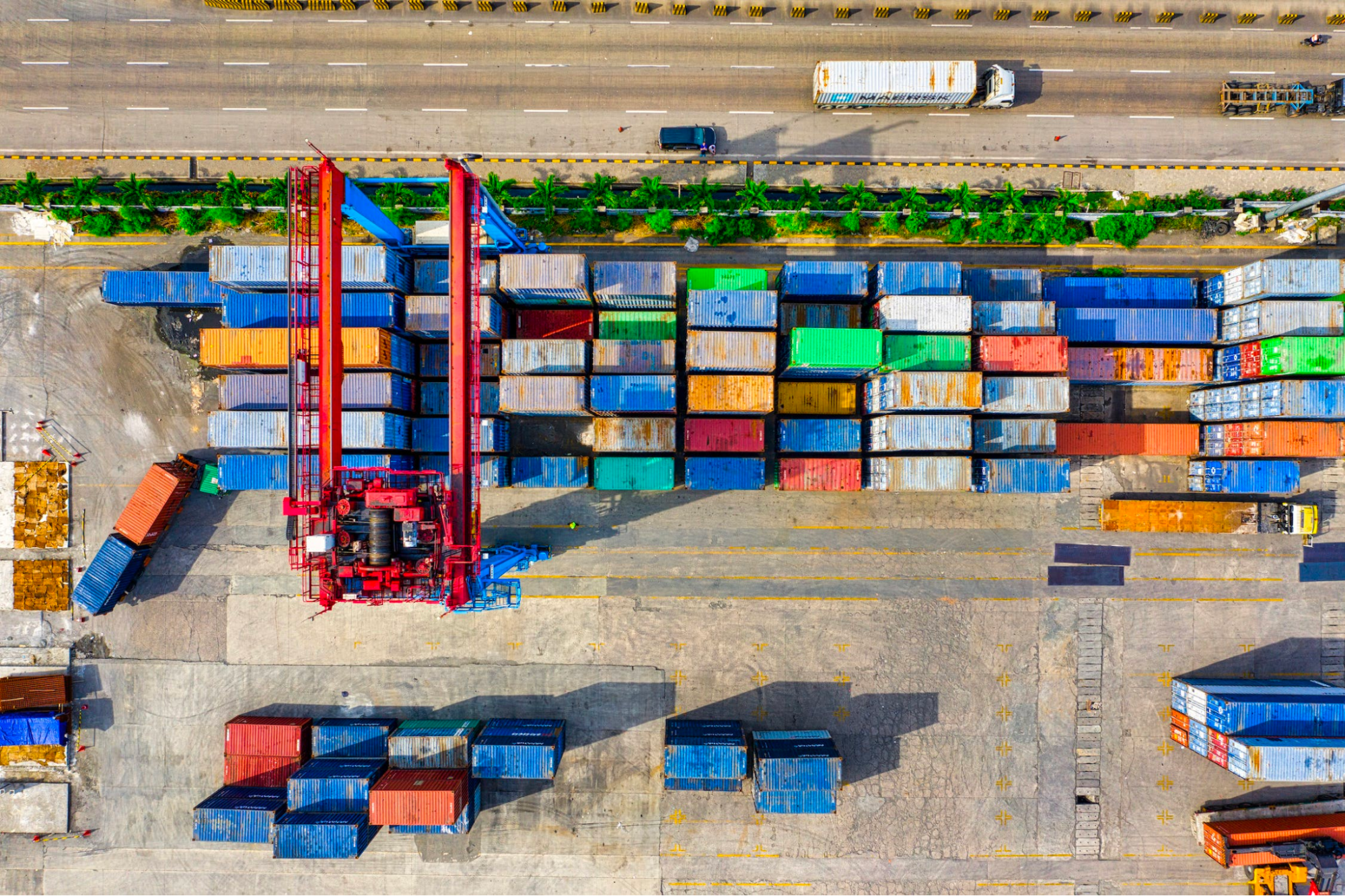Aerial view of shipping containers at a port terminal illustrating supply chain logistics and EDI 856 advance ship notice workflows