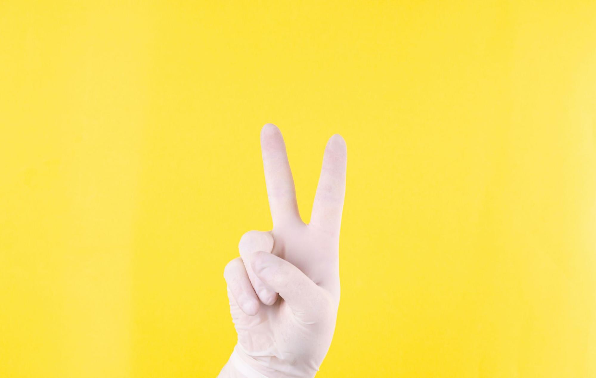 A hand showing a peace sign. 