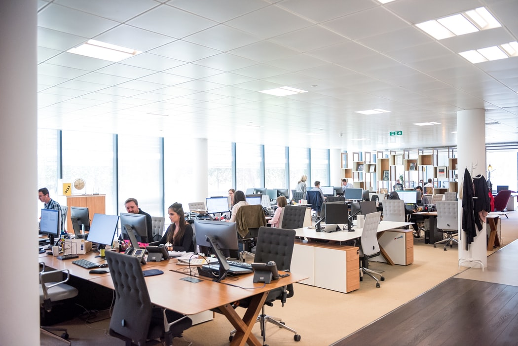 Customer service representatives working in an office. 