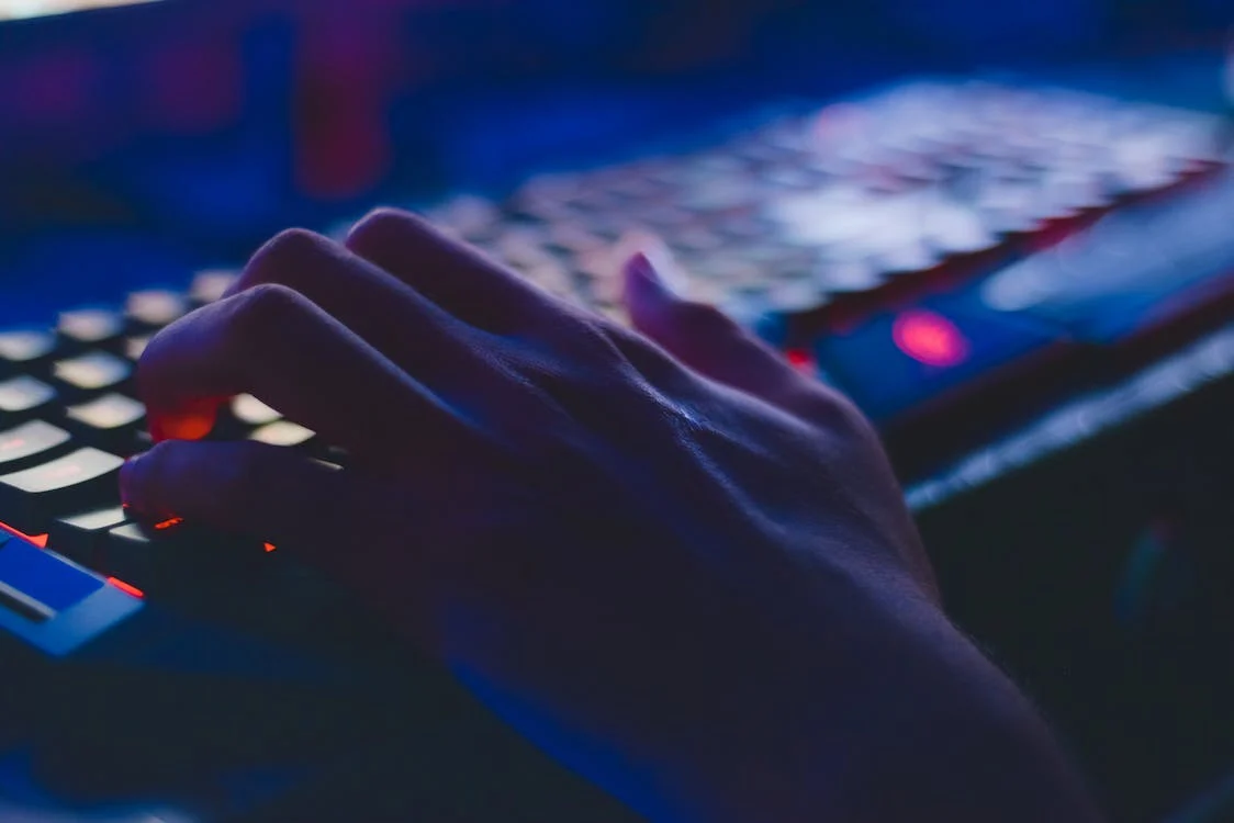 Hand typing on computer