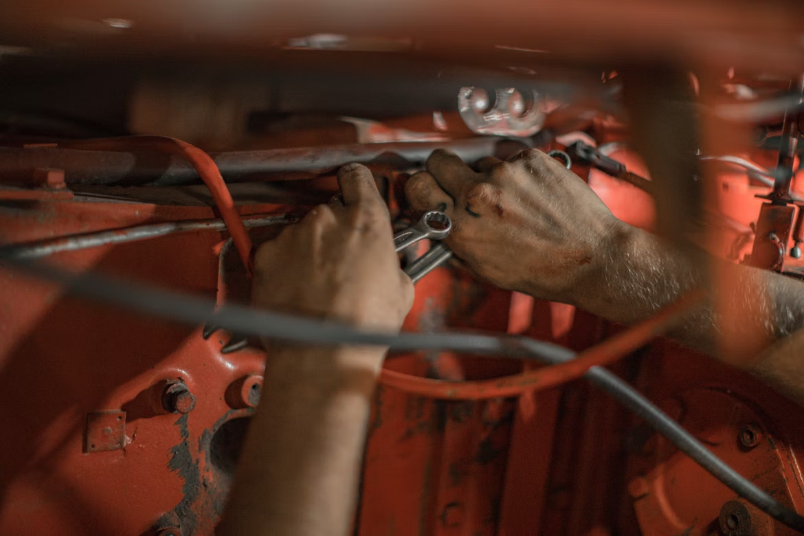A person fixing a car
