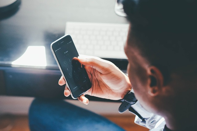 Man looking at smartphone screen