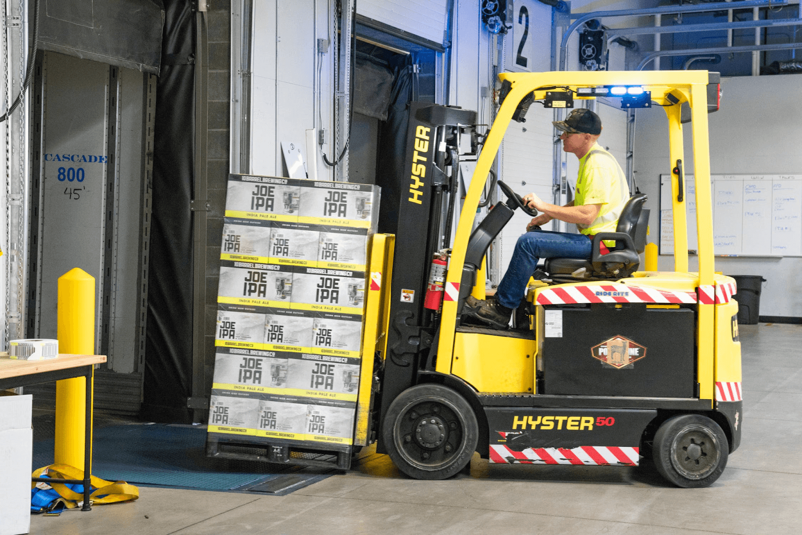 A fulfilment center worker packing an order for shipping.
