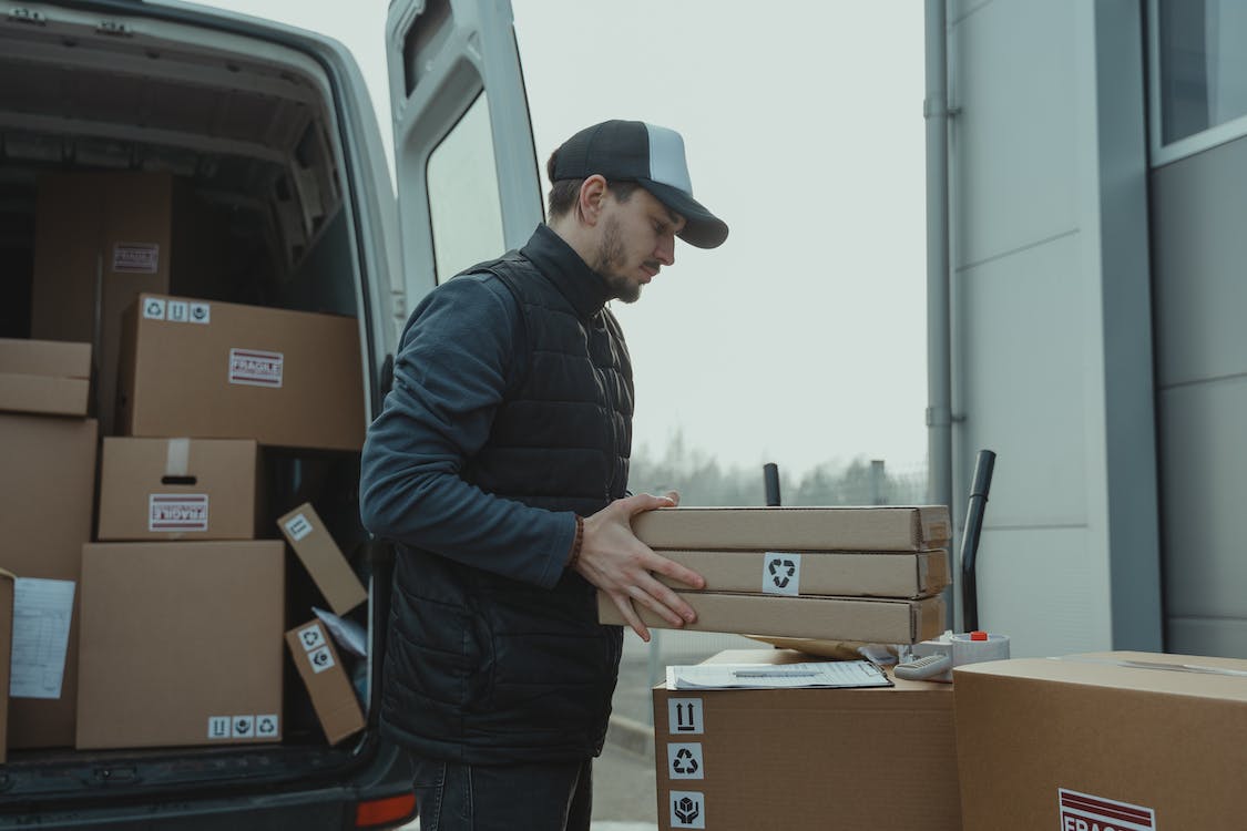 A courier delivering a dropshipping replacement order. 