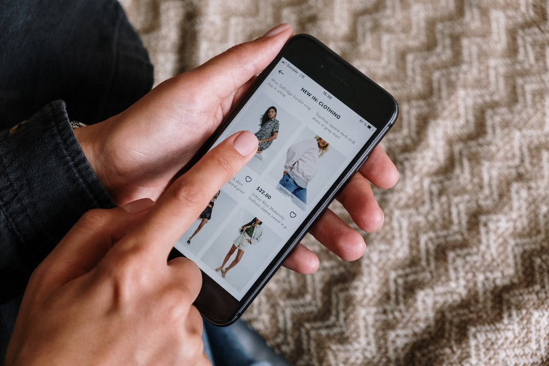 Customer shopping online on a phone.