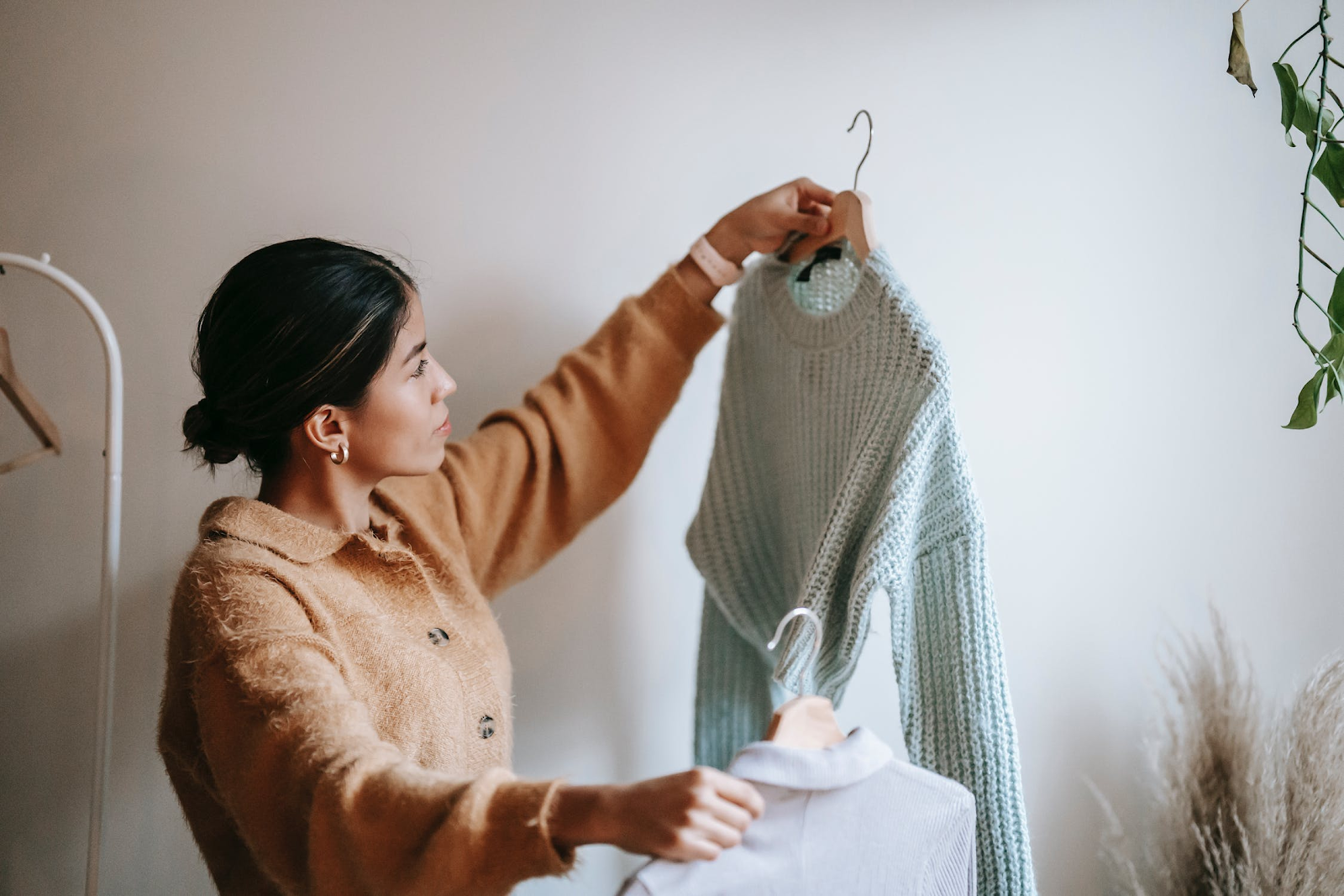 Person looking at clothes they bought online.
