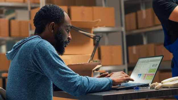 eCommerce store owner managing their site on a laptop. 