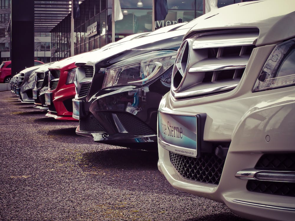 Cars displayed at an automotive tradeshow.