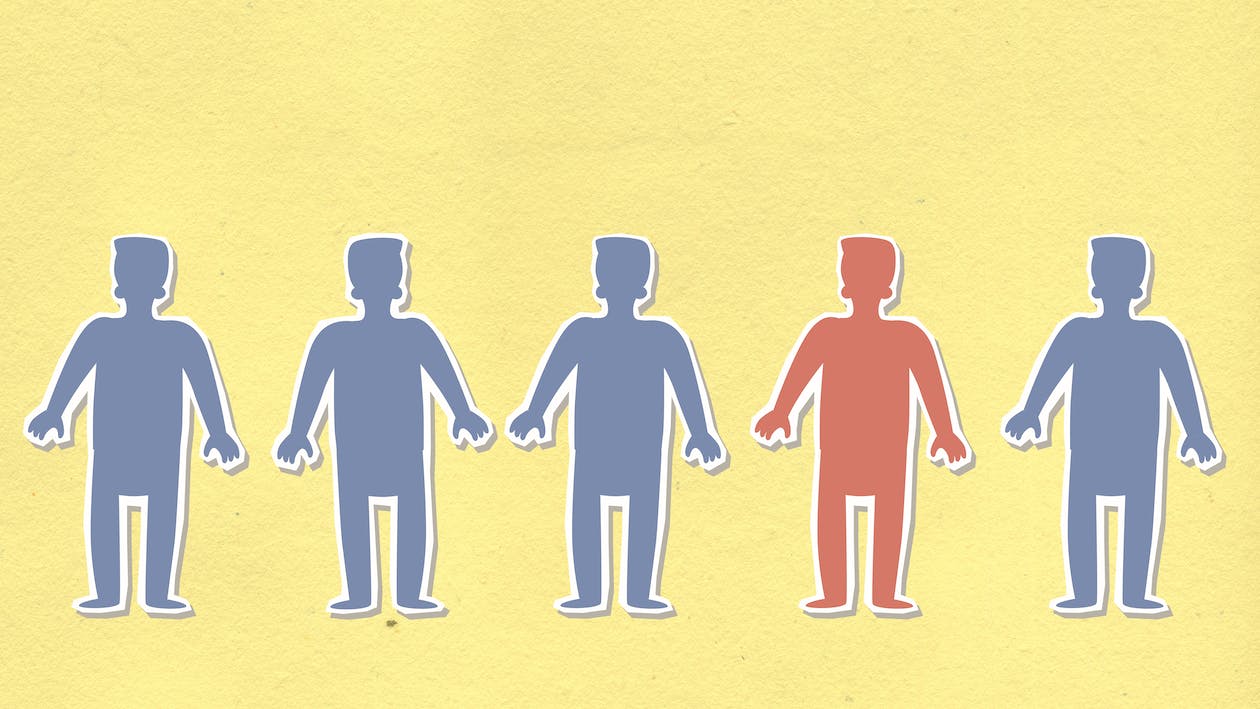 Cartoon of five identical people, but one is a different color.