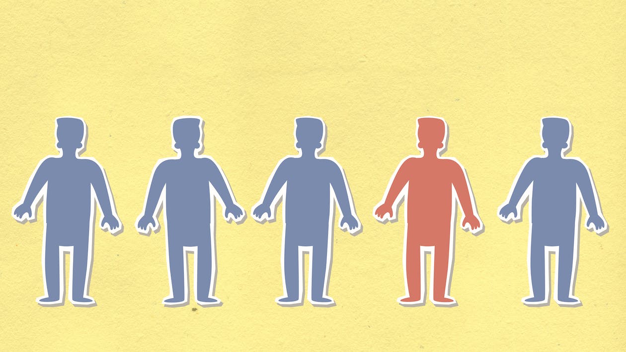 Cartoon of five identical people, but one is a different color.