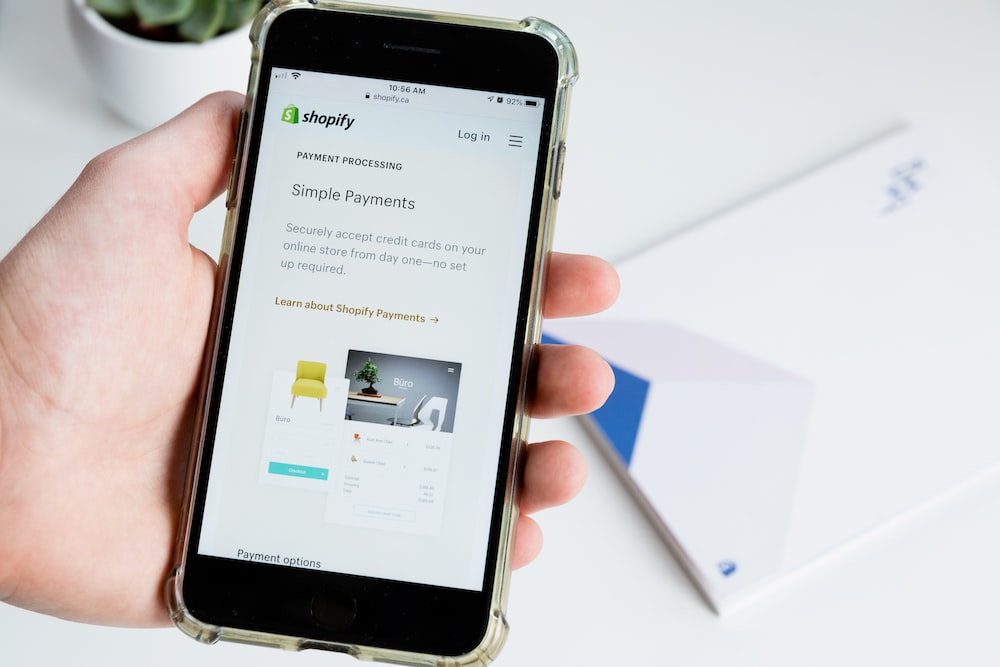 Phone screen showing a product listing on Shopify