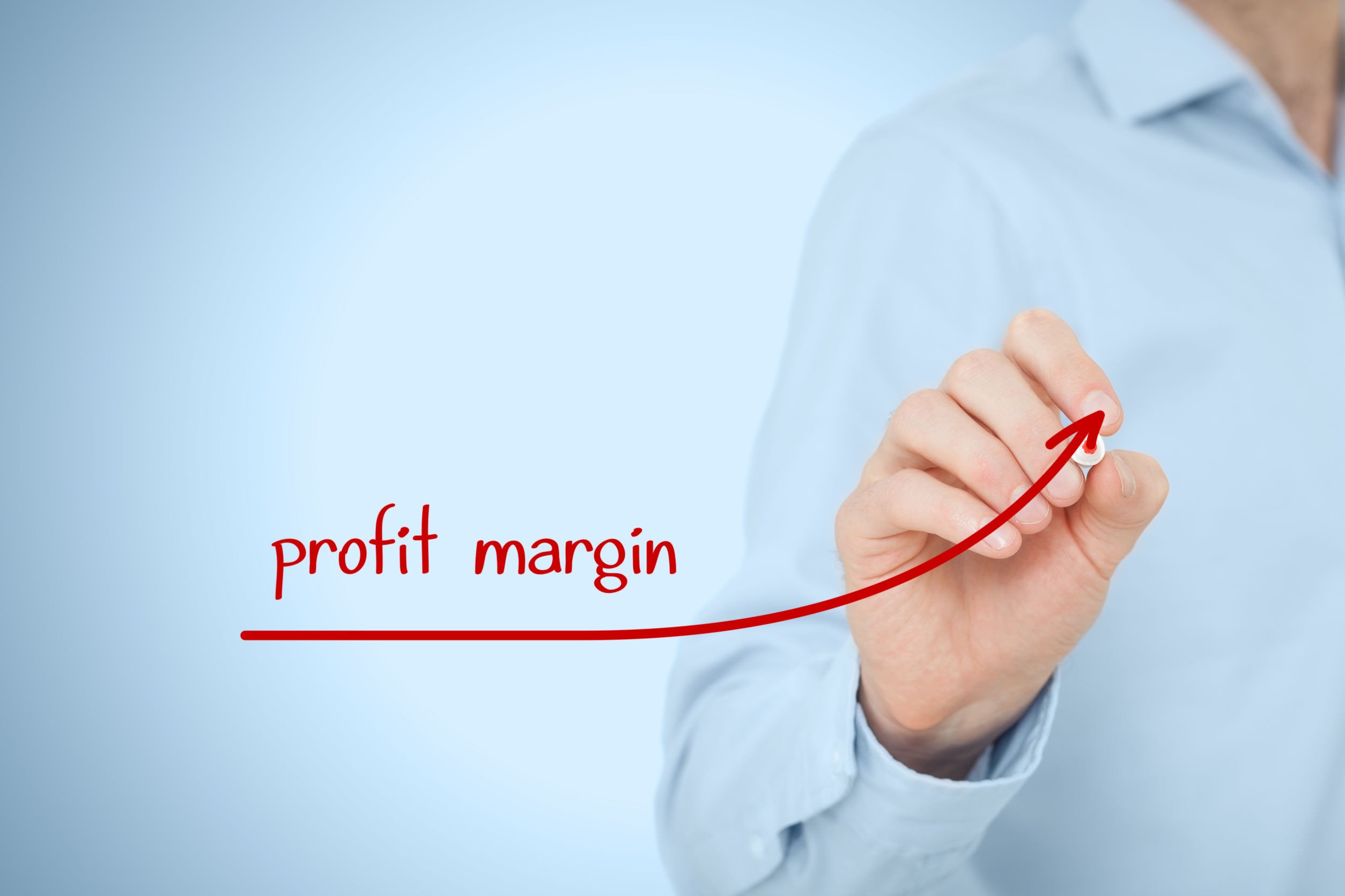 Person drawing profit margin graph