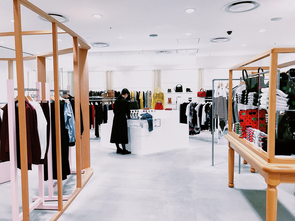 a person shops in-person in a well-lit retail space